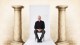 A man sitting in a chair.